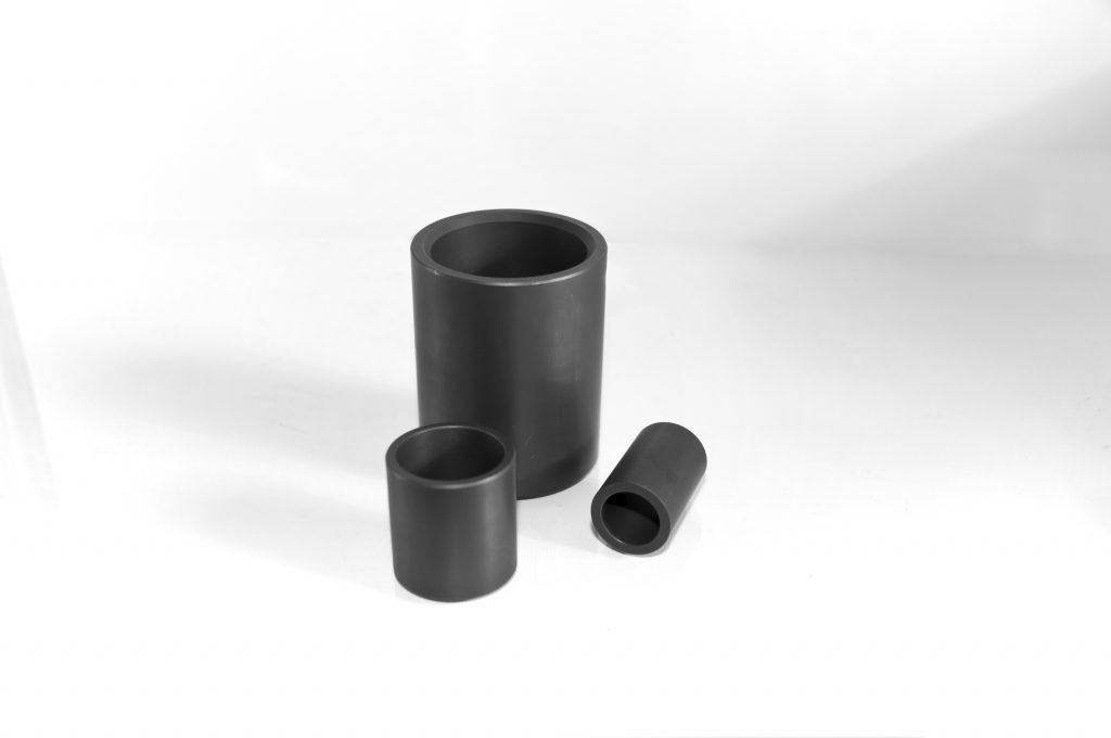 an image of three carbon graphite bearings, carbon bushings, carbon bearings