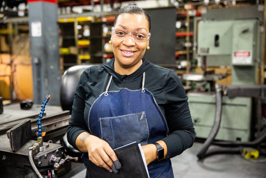Copyrighted 2018 Ken Cooper. A woman works in the factory at Helwig Carbon.